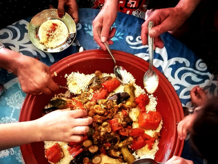 Eating Moroccan couscous with the family